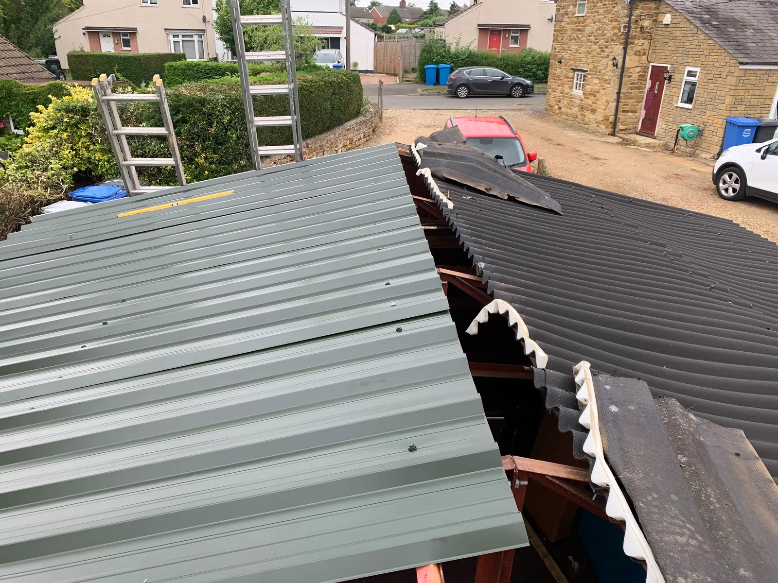Corrugated garage roof sheets being replaced