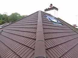New tiled hip roof with a chimney