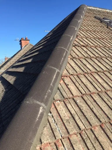 Ridge tiles refitted on a roof