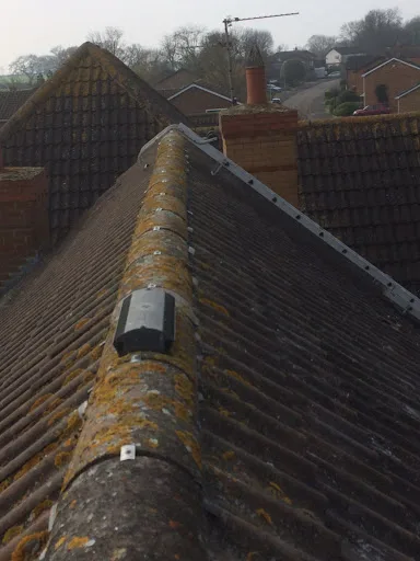 Ridge tiles and roof vent after repairs