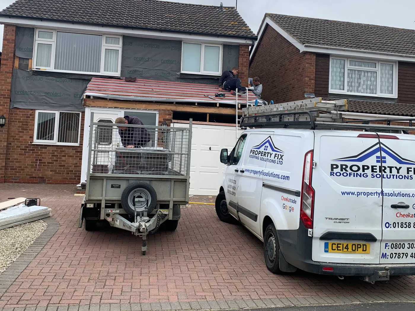 The Property Fix Roofing Solutions Ltd van and trailer outside a roof replacement in progress