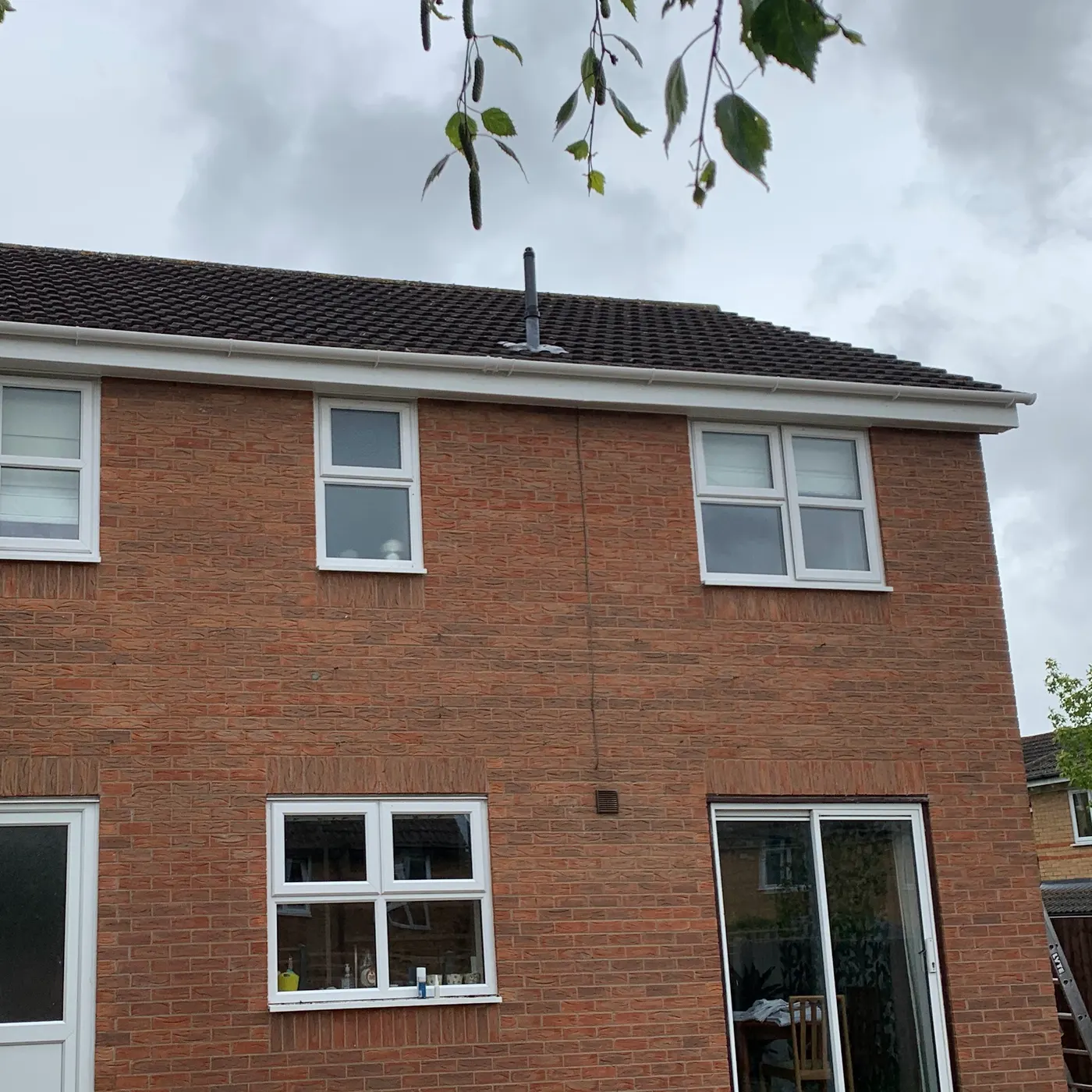 The Property Fix Roofing Solutions Ltd team fitting new fascias and soffits on a brick house